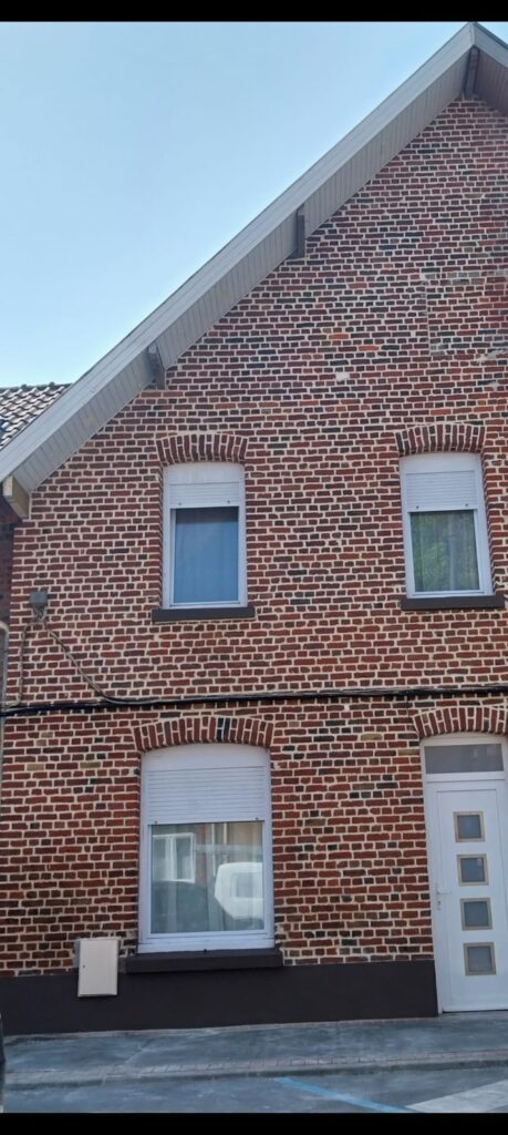 Pignon en brique rénové après ravalement de façade